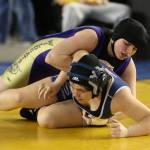 Caitlin Woodworth tries to put her opponent on her back. (Photo by John Fisken)