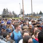Oak Harbor High School students, evacuated Thursday due to a bomb threat, bottleneck as they wait to be picked up by parents or guardians. Photo provided by Elaine Reyes Torres