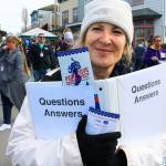 Volunteer Lynn Hyde was a walking information booth Saturday, answering any questions visitors may have.                                Photo by Patricia Guthrie/Whidbey News-Times