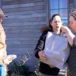The Vrable family drops off food and a gift to Georgie Smith and her family Wednesday. Smith said she&rsquo;s been heartened by the outpour of community support since her family&rsquo;s historic barn burned down Monday night. Photo by Ron Newberry/Whidbey News-Times