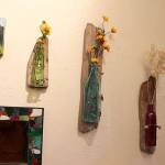 Art created by Whimsies shop owner Charlotte Gray includes bottles made into wall vases and mosaic mirror creations. Photo by Patricia Guthrie/Whidbey News-Times