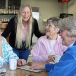 Photo by Patricia Guthrie/Whidbey News-Times                                Daily Grind owner Tammie DeRosa greets some regular customers, one of many senior groups that gather daily at the Oak Harbor downtown shop that&rsquo;s closing March 31.