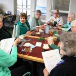 Photo by Patricia Guthrie/Whidbey News-Times                                A group of women who call themselves &ldquo;The Ladies of the Downtown Pool&rdquo; regularly make The Daily Grind a part of their &ldquo;swimming and sipping&rdquo; routine. They are one of about a dozen groups of senior citizens that prefer meeting there to chat, play cribbage, do crossword puzzles and &ldquo;solve the world&rsquo;s problems.&rdquo;