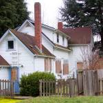 A historic farmhouse, where Oak Harbor&rsquo;s Lorraine Weatherby lived as a child in the 1930s, is one of eight homes on Navy property that people may acquire for no cost to save from demolition. The stipulation is that the buyer must pay to move the homes. Photo by Ron Newberry/Whidbey News-Times