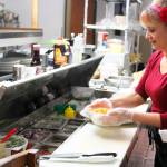 Silvia Acuna, mother of restaurant owners, Noe and Jose Ochoa, prepares a bowl of pozole for a customer at Noe Jose Cafe. She cooks authentic Mexican dishes that have been passed down from generations in her family.                                Photo by Patricia Guthrie/Whidbey News-Times