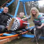Scott and Brittany Brazelton pose near their home-made roller coaster, with son Wyatt and dog Allie Wednesday, March 1, 2017 at their Oak Harbor home. Photo by Ron Newberry/Whidbey News-Times
