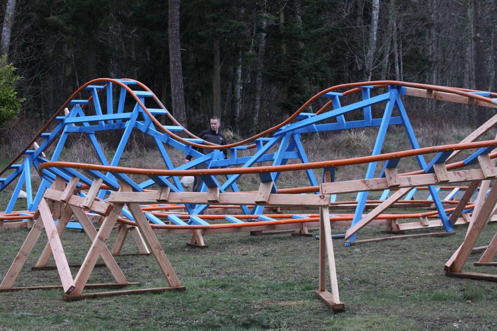 Scott Brazelton stands behind the roller coaster he built on his Oak Harbor property Wednesday, March 1, 2017. Photo by Ron Newberry/Whidbey News-Times