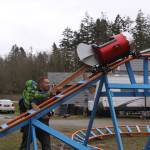 Scott Brazelton, with help from his son Wyatt, gets the roller coaster cart in position to launch at his property in Oak Harbor Wednesday, March 1, 2017. Brazelton, a Navy pilot, built a roller coaster from scratch for his 3-year-old son. Photo by Ron Newberry/Whidbey News-Times
