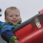 Wyatt Brazelton, 3, is all smiles as he prepares to go on a ride around the roller coaster that his father built for him in their Oak Harbor backyard Wednesday, March 1, 2017. Photo by Ron Newberry/Whidbey News-Times
