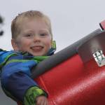 Wyatt Brazelton, 3, is all smiles as he prepares to go on a ride around the roller coaster that his father built for him in their Oak Harbor backyard Wednesday, March 1, 2017. Photo by Ron Newberry/Whidbey News-Times