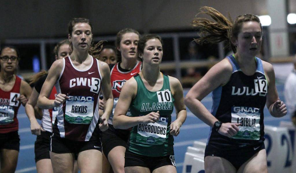 Alex Laiblin, right, runs to 19th place in the GNAC Indoor Track and Field Championships. (Photo by Loren Orr)