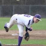 Trent Benson fires a pitch through the rain drops Wednesday. (Photo by John Fisken)