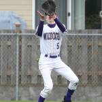 Oak Harbor left fielder Will Danielson looks in a fly ball. (Photo by John Fisken)