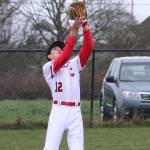 Joey Lippo settles under a Sequim fly ball. (Photo by John Fisken)