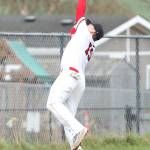Coupeville third baseman Dane Lucero reaches back to make a play. (Photo by John Fisken)