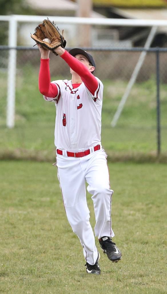 Coupeville outfielder Ethan Marx snags a flyball in the loss to Klahowya Wednesday. (Photo by John Fisken)
