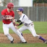 Cory Roberts tags M-P&rsquo;s Colby Phelps in a rundown Wednesday. (Photo by John Fisken)