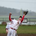 Pitcher Hunter Smith reaches back to snag a pop-up in Saturday&rsquo;s win. (Photo by John Fisken)