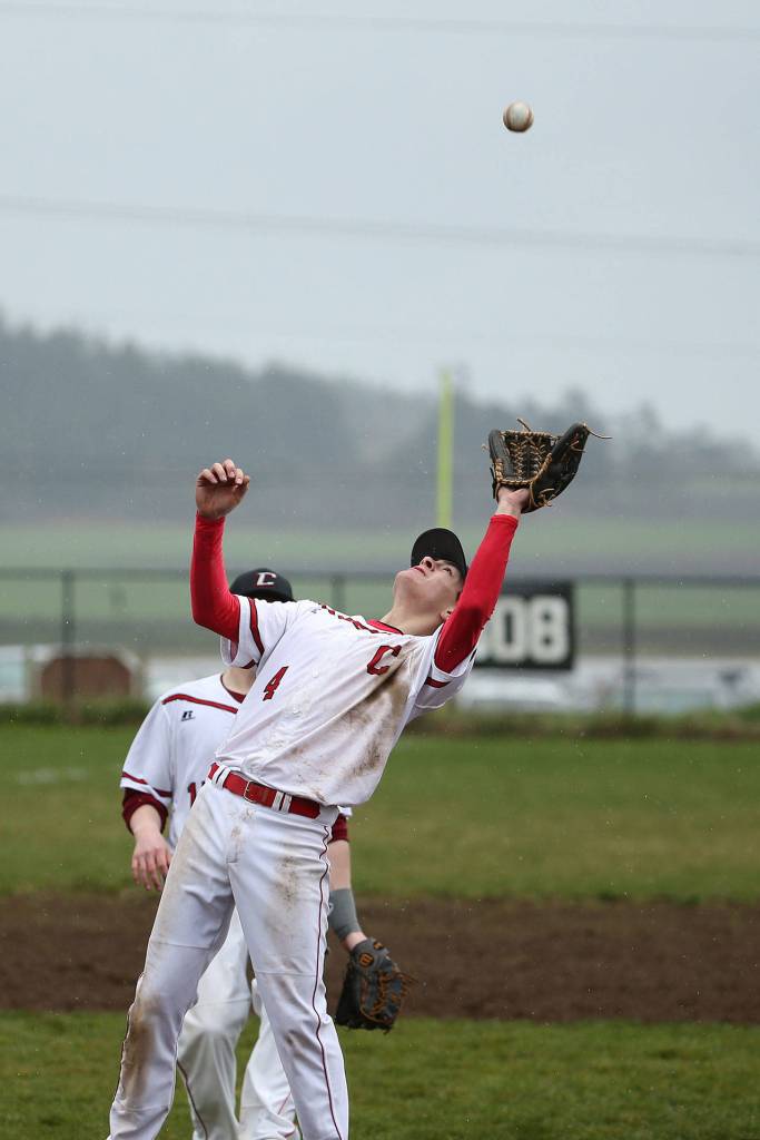Pitcher Hunter Smith reaches back to snag a pop-up in Saturday&rsquo;s win. (Photo by John Fisken)