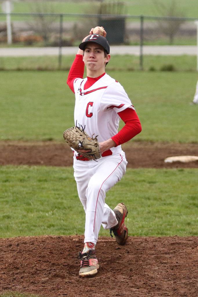 Nick Etzell picks up a save in the win over South Whidbey. (Photo by John Fisken)