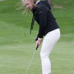 Kayleigh Burbank lines up a putt Tuesday. (Photo by John Fisken)
