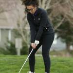 Makayln Miller lines up her tee shot in the Whidbey Shootout. (Photo by John Fisken)