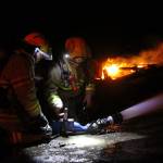 Firefighters attack the flames that engulfed the Smith Barn Monday night, March 6, 2017. Photo by Ron Newberry/Whidbey News-Times
