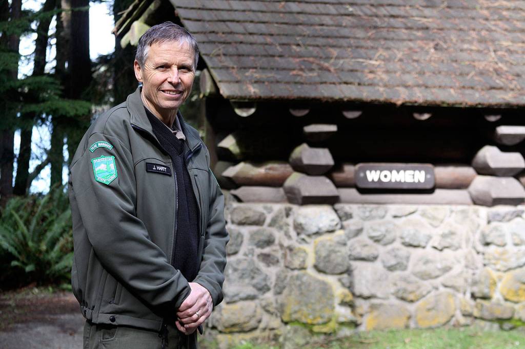 Jack Hartt, Deception Pass State Park manager, stands near a restroom near North Beach that has frequently closed due to a failing pump and sewer system. Fixing that issue is one of several projects in store for the state park in 2017. Photo by Ron Newberry/Whidbey News-Times