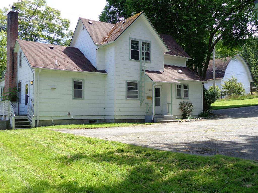Quarters O, what for a century has been known as the Riksen farmhouse, was built around 1900 by Henry Riksen. It is one of eight historic farmhouses near Ault Field slated for demolition, possibly as early as this year. Pacific Northwest Communities, LLC, which owns the homes, is offering the homes for free although the buyers must pay to move them to a new location. Photo provided by NAS Whidbey