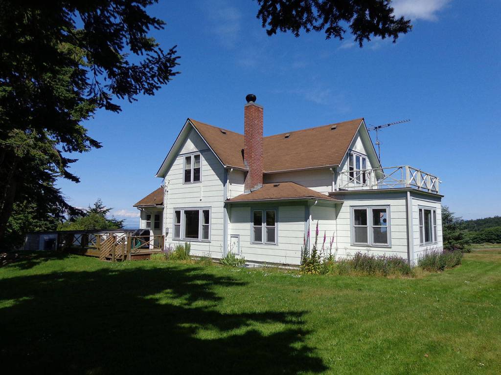 Quarters K, built in 1895, is going to be saved and will continue to offer Navy housing. It is located near the Gallery Golf Course and features a saltwater view. Two homes nearby are among the eight slated for demolition. Photo provided by NAS Whidbey