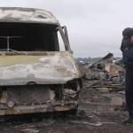 Charlie Smith, deputy fire chief with Central Whidbey Fire & Rescue, examines a delivery van Tuesday morning that was destroyed in Monday night&rsquo;s fire that took down the historic Smith Barn at Willowood Farm in Coupeville. The fire occurred at 8 p.m. Monday night. Photo by Ron Newberry/Whidbey News-Times