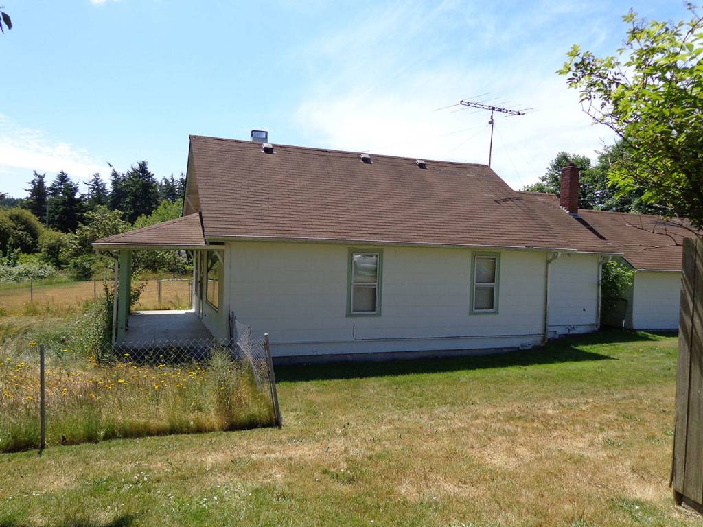 Quarters R, built in 1930, is one of eight historic farmhouses near Ault Field slated for demolition, possibly as early as this year. Pacific Northwest Communities, LLC, which owns the homes, is offering the homes for free although the buyers must pay to move them to a new location. Photo provided by NAS Whidbey
