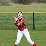 Coupeville right fielder Robin Cedillo makes like Willie Mays with a basket catch. (Photo by John Fisken)