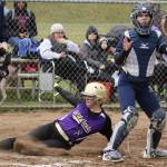 Shea Davis scores for Oak Harbor in the second inning. (Photo by John Fisken)
