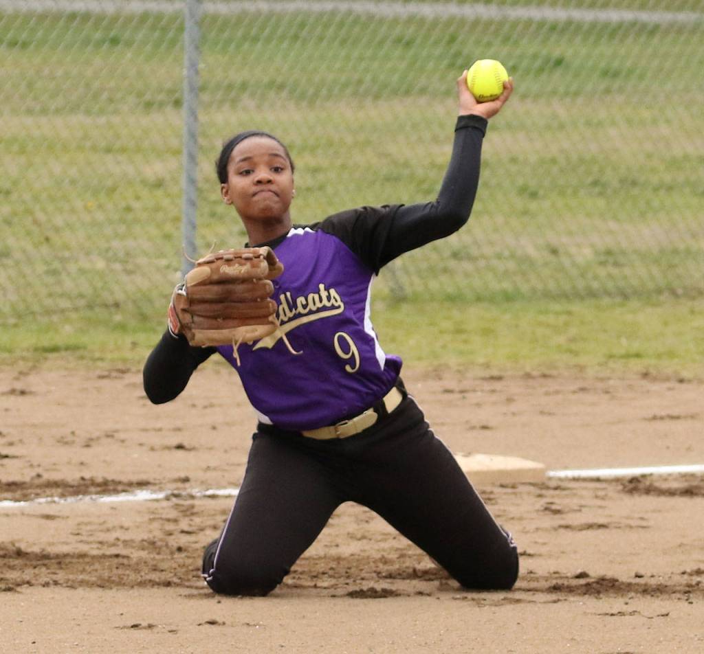After making a stop, Wildcat third baseman Audrey Howard fires to first from her knees. (Photo by John Fisken)