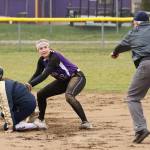 The umpires calls an Arlington base runner out as Rylee Joseph applies the tag. (Photo by John Fisken)