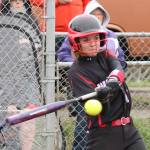 Katrina McGranahan slugs a home run for the Wolves. (Photo by John Fisken)