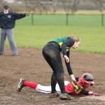 Umpire Rita Cline calls Coupeville&rsquo;s Tamika Nastali safe as she slides in under the tag of Vashon Island&rsquo;s Abby Lawson. (Photo by John Fisken)