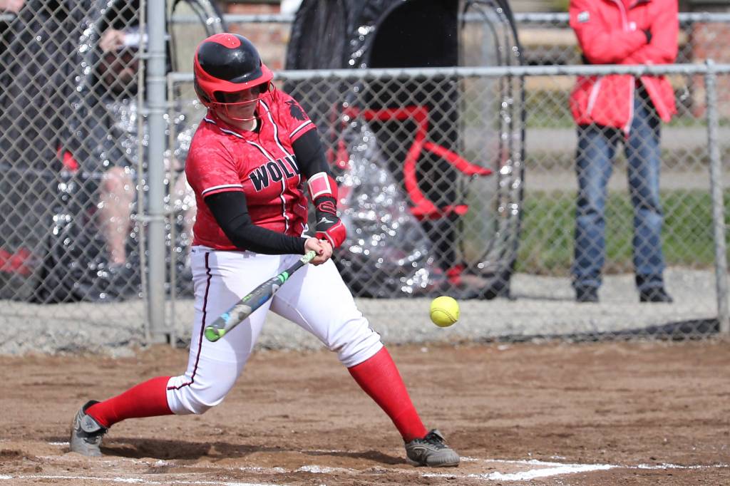 Sarah Wright smacks a base hit for the Wolves. (Photo by John Fisken)