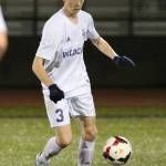 Nathan Merrill gains control for Oak Harbor against Jackson. (Photo by John Fisken)