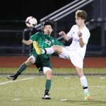 Nathan Merrill beats Edmonds-Woodway&rsquo;s Andrew Shin (23) to the ball. (Pboto by John Fisken)
