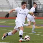JJ Mitchell moves the ball up the field for Oak Harbor Saturday. Mitchell scored twice for the Wildcats in the 2-1 win. (Photo by John Fisken)