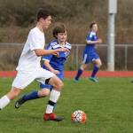 William Nelson rushes the ball up the field for the Wolves. (Photo by John Fisken)
