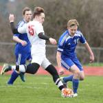 Ethan Spark, who scored twice for Coupeville, fires a shot past a Chimacum defender. (Photo by John Fisken)