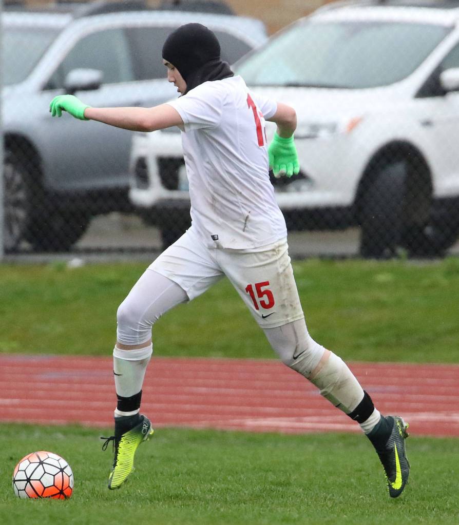 Ethan Spark dribbles up the field in Friday&rsquo;s match. (Photo by John Fisken)