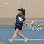 Kartrina Martinez prepares to hit a backhand in her third doubles win with partner Alyssa Schneider. (Photo by John Fisken)