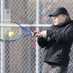 Sage Renninger smacks a forehand in first doubles. (Photo by John Fisken)