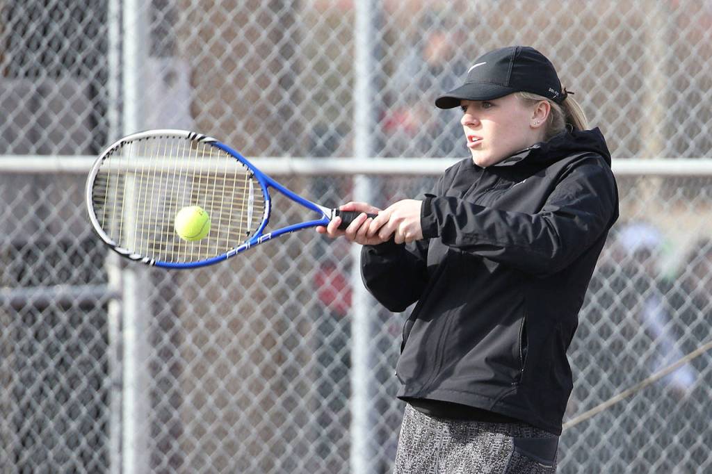 Sage Renninger smacks a forehand in first doubles. (Photo by John Fisken)