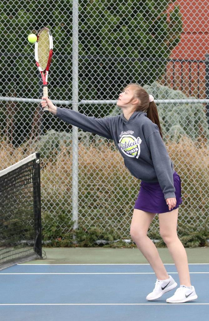 Alyssa Schneider smacks an overhead shot Wednesday. (Photo by John Fisken)