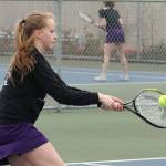 Chloe Stewell hits a backhand during second doubles. (Photo by John Fisken)